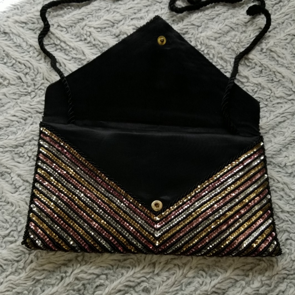 Striking sequined convertible envelope bag by Fashion Imports